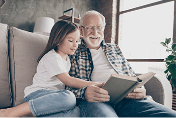 An older Florida man is able to enjoy reading a book to his granddaughter despite his hearing loss.